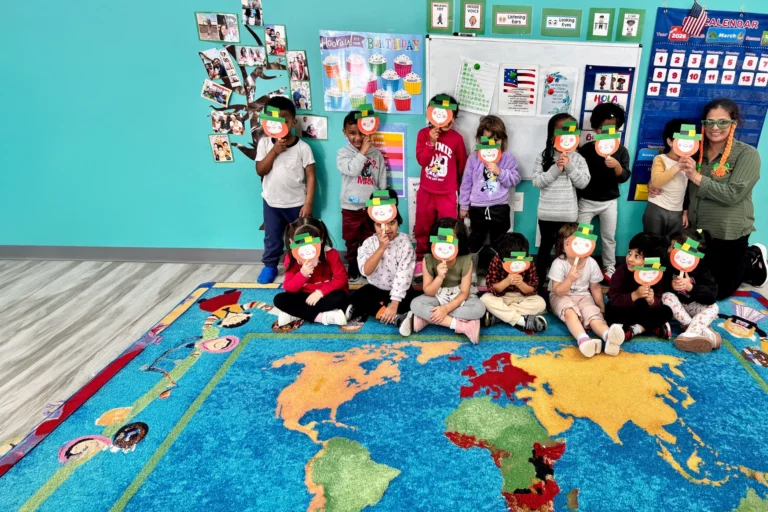 Classroom celebrating a themed dress-up day on the world map rug